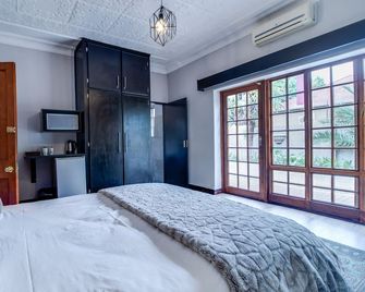 The Nightingale Guesthouse - Bloemfontein - Yatak Odası