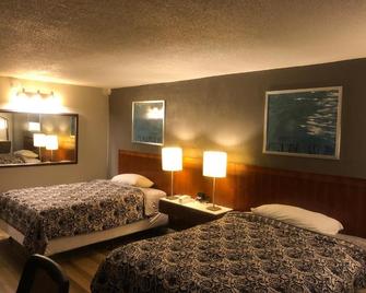 Western Inn - Houston - Schlafzimmer
