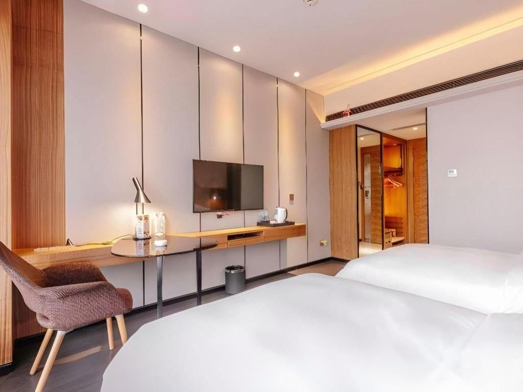 Borrman Hotel Kunming Changshui Airport Center - קונמינג - חדר שינה