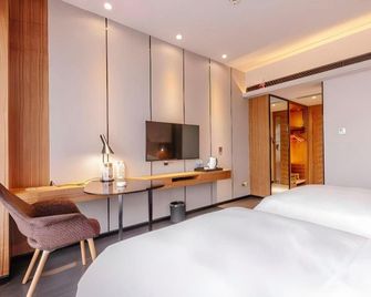 Borrman Hotel Kunming Changshui Airport Center - Kunming - Habitación