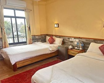 Peacock - a family-run hotel - Sauraha - Schlafzimmer