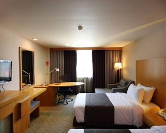 فندق رامادا سونغدو - إنشيون - غرفة نوم