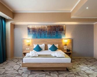 Renion Park Hotel - אלמאטי - חדר שינה