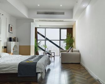 Evening Breeze Lake View Smart Cinema B&B Hotel (Bengbu Wanda Plaza Branch) - Bengbu - Спальня