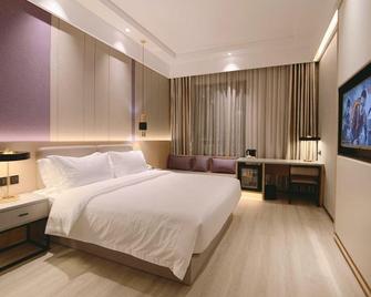 Puhe Hotel - Bozhou - Schlafzimmer