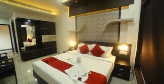 Hotel Le Moshe Inn - Ramanattukara - Bedroom