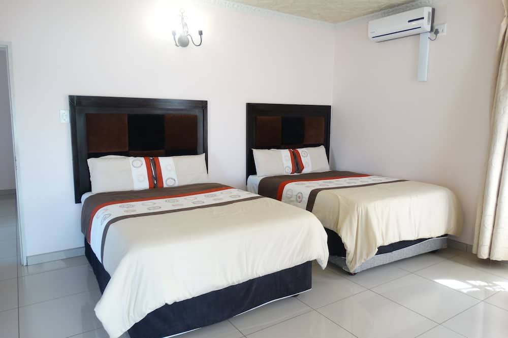 جلوبال فيلادج جست هاوس - مانزيني - غرفة نوم