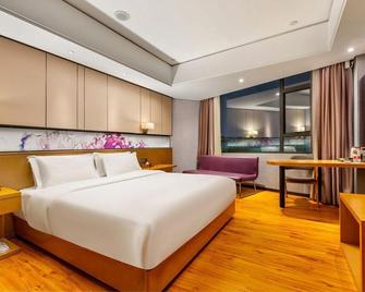 Enjoy Hotels (Guangzhou Sanyuanli Metro Station) - Cantón - Habitación