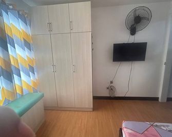 Minimalist Room in Imus Condo with netflix and round-clock Security - Imus