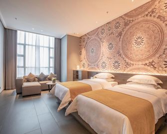 Mandoron Plus Smart Hotel (Jiangmen Hexing Plaza Branch) - Jiangmen - Bedroom
