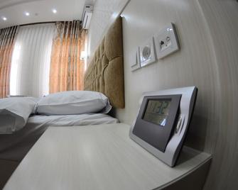 Hotel Afrosiyob - Qarshi - Habitación