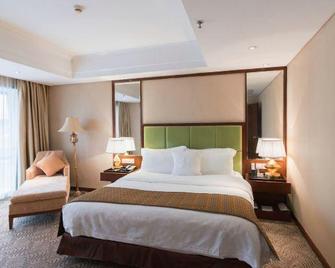Liuzhou Grand Hotel City Center - Liuzhou - Yatak Odası