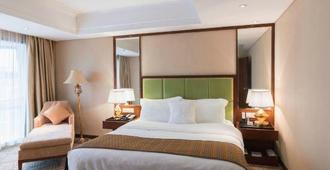Liuzhou Grand Hotel City Center - Liuzhou - Bedroom