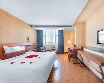 James Joyce Coffetel Qinhuangdao Wanda Plaza Railway Station - Qinhuangdao - Bedroom