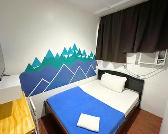 Dormitelsph España - Manila - Habitación