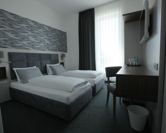 Hotel Starton am Ingolstadt Village - Ingolstadt - Schlafzimmer