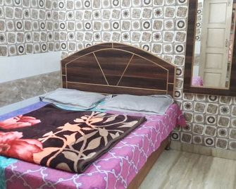 Goroomgo Sai Kripa Guest House Haridwar - Харідвар - Спальня