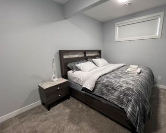 Modern, well furnished 1 bedroom home with free street parking - Spruce Grove - Bedroom