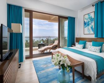 Aloha Oceanfront Suite Resort - Lingshui - Habitación