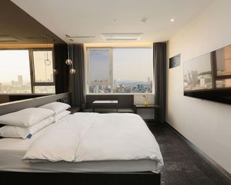 هوتل ذا ديزاينرز هونجداي - سيول - غرفة نوم
