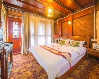 Lijiang Mufu Yuan Inn - ליז'יאנג - חדר שינה