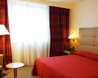 Garden Hotel - ארצו - חדר שינה