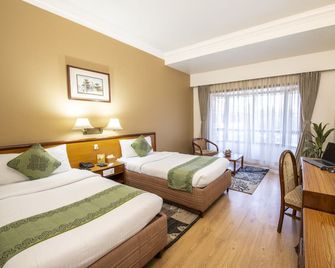 Hotel Nirvana by Luxury International - Lumbini Sanskritik - Schlafzimmer