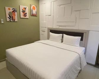 Xten Guest House - Lubuk Baja - Ložnice