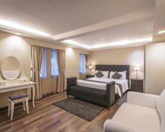 Oasis Hotel - Al-Kuwait - Camera da letto