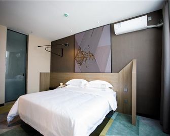 Iu Hotels· Xincheng Haibing University Store - Huludao - Camera da letto