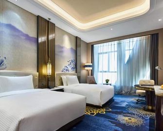 Wanda Vista Urumqi - Ürümqi - Sovrum