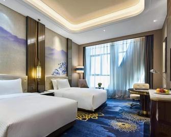 Wanda Vista Urumqi - אורומצ'י - חדר שינה