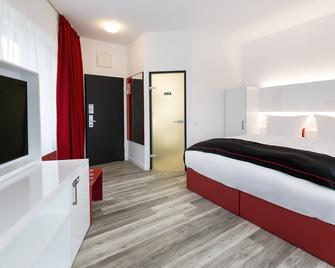 دورميرو هوتل هانوفر – لانغنهاغن أيربورت - هانوفر - غرفة نوم