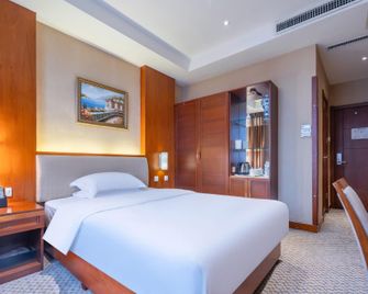 Hongcui Garden Hotel (Linyi Taisheng Plaza Branch) - Linyi - Bedroom