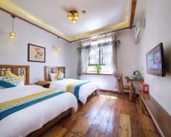 Hetianwan Inn - Zhangjiajie - Sypialnia