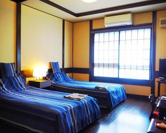 Tamachi Bukeyashiki Hotel - Semboku - Schlafzimmer
