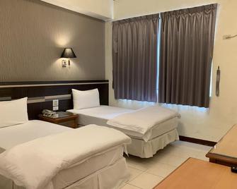 Kai Xin Hotel - Xincheng Township - Schlafzimmer