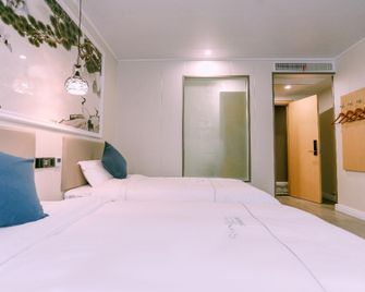 Qingmu Chain Hotel (Ma'anshan Lake Xi'nan Road Branch) - Ma'anshan - Bedroom