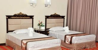 Sky Man Hotel - Rangun - Schlafzimmer