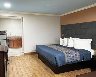 Downtowner Inns And Suites - Humble - Habitación