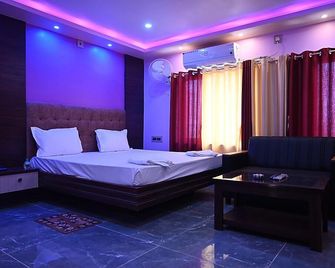 Hotel Tulusi Inn - Bolpur - Bedroom