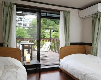 晨曦山林小屋飯店 - 神戶 - 臥室