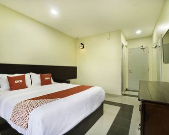 OYO 89960 Manjung Inn Hotel - Lumut - Спальня