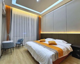 Feilong Siji Hot Spring Hotel - Daqing Shi - Slaapkamer