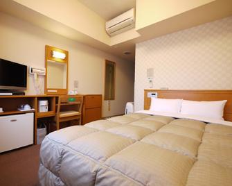 Hotel Route-Inn Shinjyo Ekimae - Shinjō - Bedroom