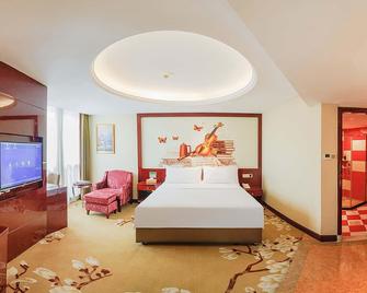Vienna International Hotel Shiyan Wuyan Pedestrian Street - Shiyan - Habitación