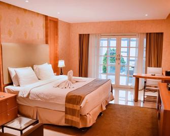 Portola Grand Renggali Hotel Takengon - Takengon - Bedroom
