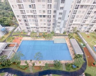 Cozy Living Studio Apartment at Scientia Residence By Travelio - Curug - Pool