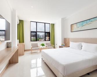 Floral Lingshui Yuwan Holiday Hotel - Lingshui - Slaapkamer