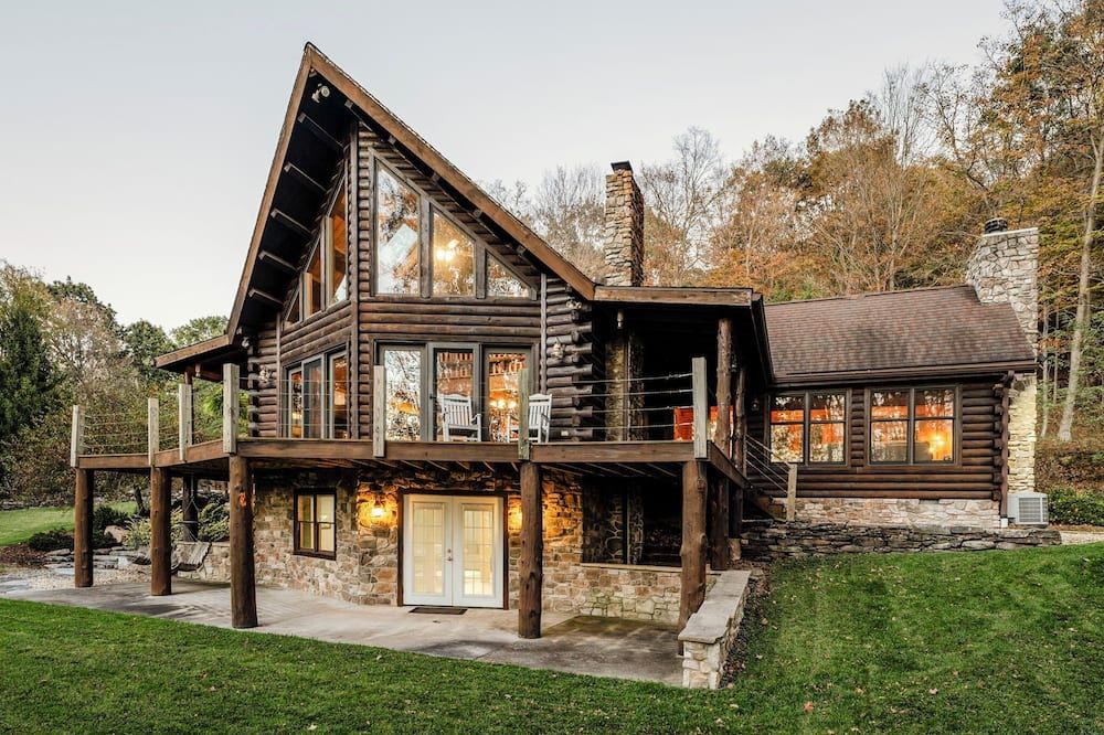 Log Cabin with living room fireplace and hot tub